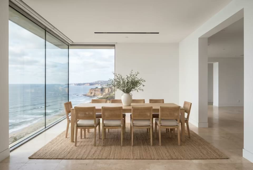 Staged dining room with ocean views